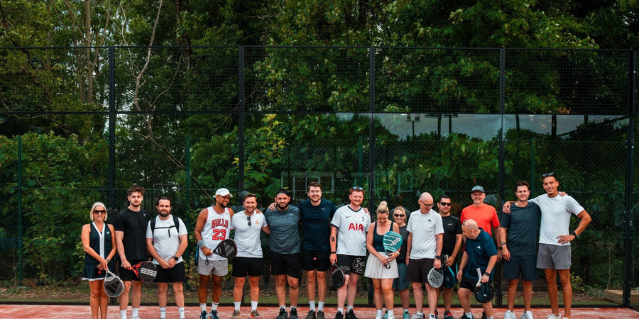 Group of padel players on court at a Padel X Americano social event