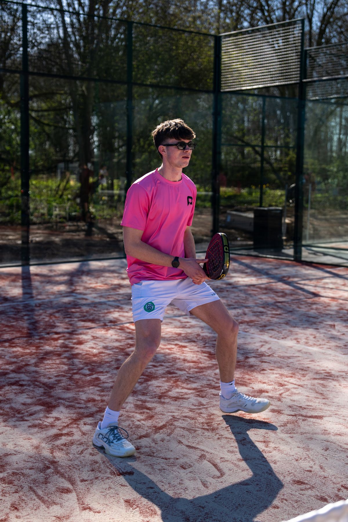 Padel X coach ready to volley at the net